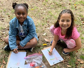 girls drawing in the park